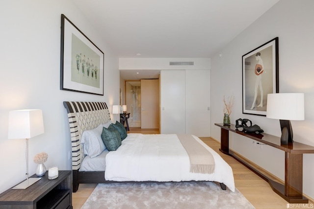 bedroom featuring light hardwood / wood-style floors