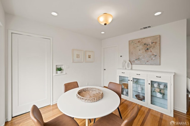 dining room featuring visible vents, wood finished floors, and recessed lighting