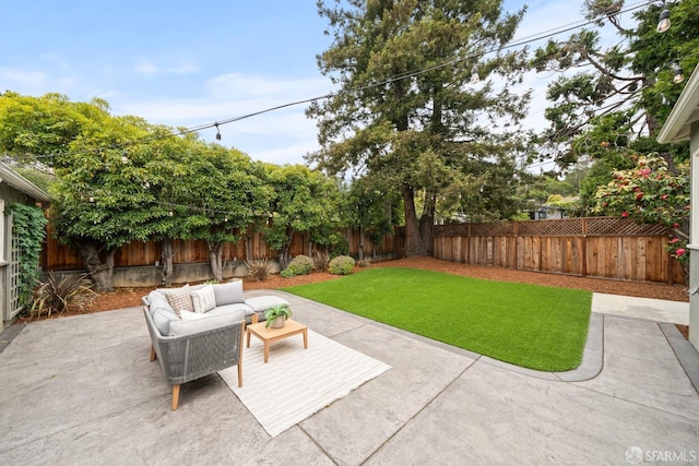 view of yard with a patio, an outdoor living space, and a fenced backyard