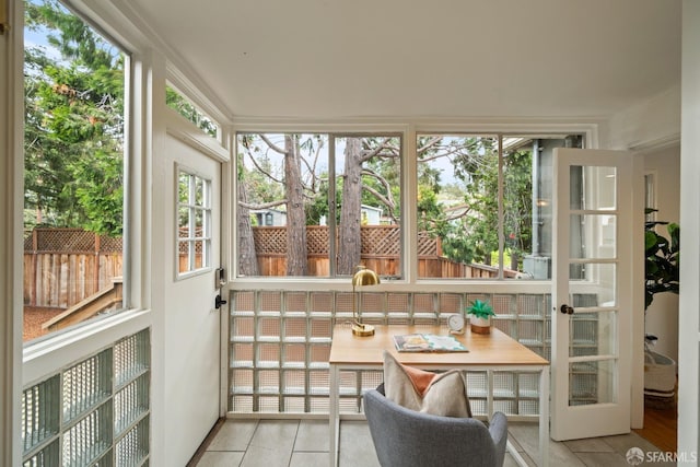 sunroom / solarium featuring tile patterned floors