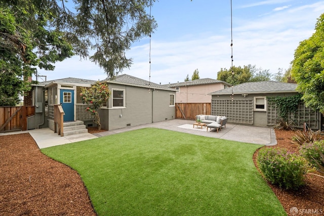 back of property featuring a lawn, an outdoor hangout area, a fenced backyard, and a patio area