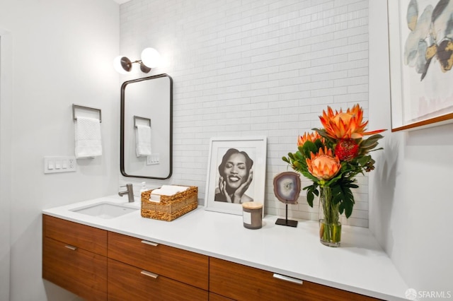 bathroom with vanity and backsplash