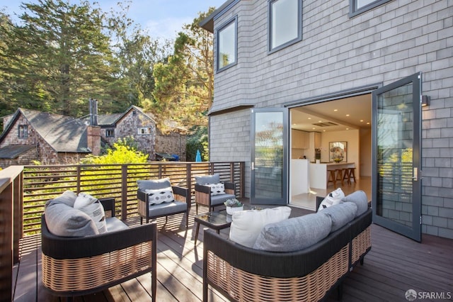 wooden deck featuring an outdoor living space