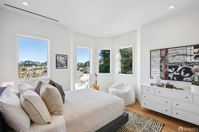 bedroom with light hardwood / wood-style flooring