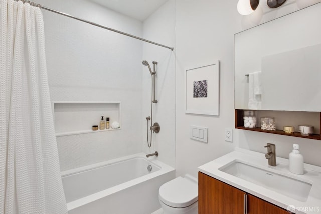 full bathroom featuring vanity, shower / tub combo, and toilet