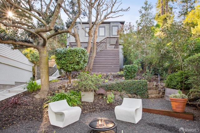 view of yard with an outdoor fire pit