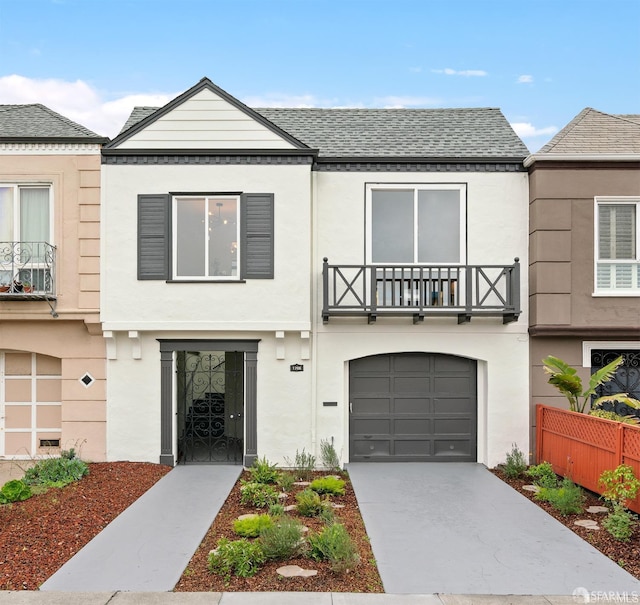 1706 42nd Ave, San Francisco, CA 94122 - view of front facade with a garage, a balcony, concrete driveway, and stucco siding