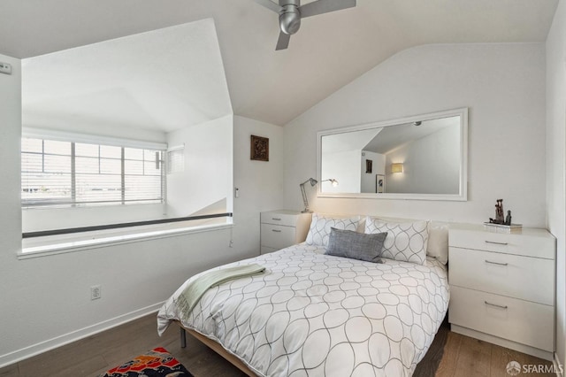 bedroom featuring lofted ceiling, a ceiling fan, baseboards, and dark wood-style flooring