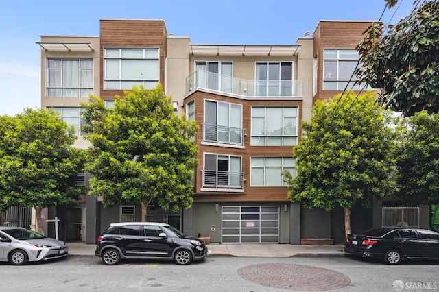 75 Moss St Unit 14, San Francisco, CA 94103 - view of building exterior with an attached garage