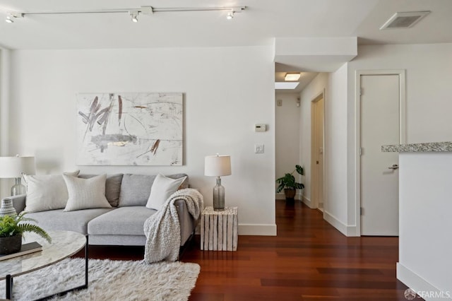 75 Moss St Unit 14, San Francisco, CA 94103 - living area featuring wood finished floors, baseboards, and track lighting
