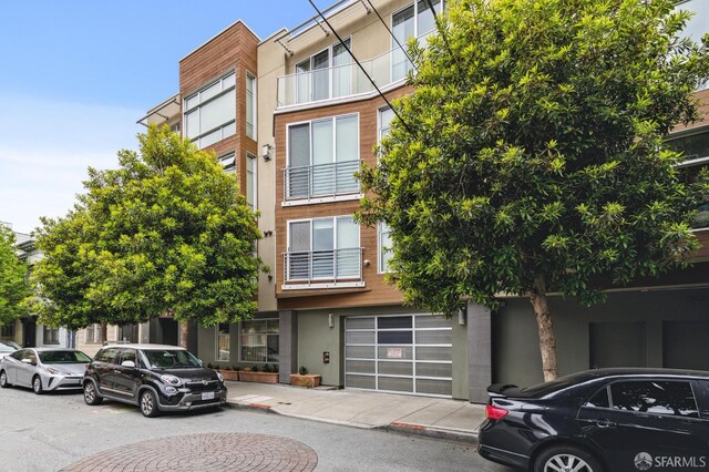 75 Moss St Unit 14, San Francisco, CA 94103 - view of property featuring an attached garage and driveway