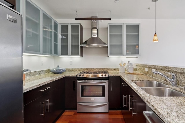 75 Moss St Unit 14, San Francisco, CA 94103 - kitchen with appliances with stainless steel finishes, a sink, light stone countertops, glass insert cabinets, and pendant lighting