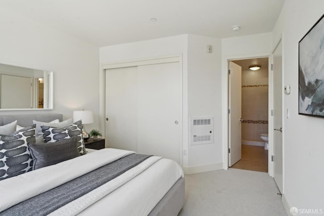 75 Moss St Unit 14, San Francisco, CA 94103 - carpeted bedroom with heating unit, a closet, baseboards, and ensuite bath