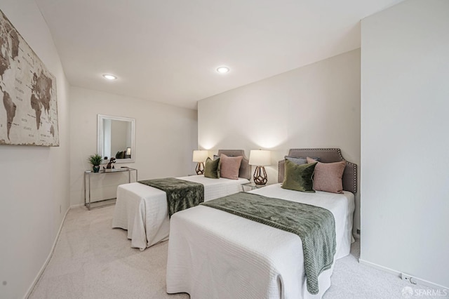 bedroom featuring recessed lighting, light colored carpet, and baseboards