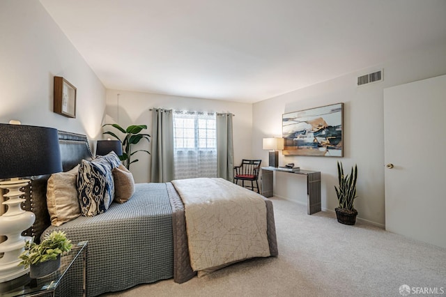 bedroom featuring visible vents, baseboards, and carpet floors