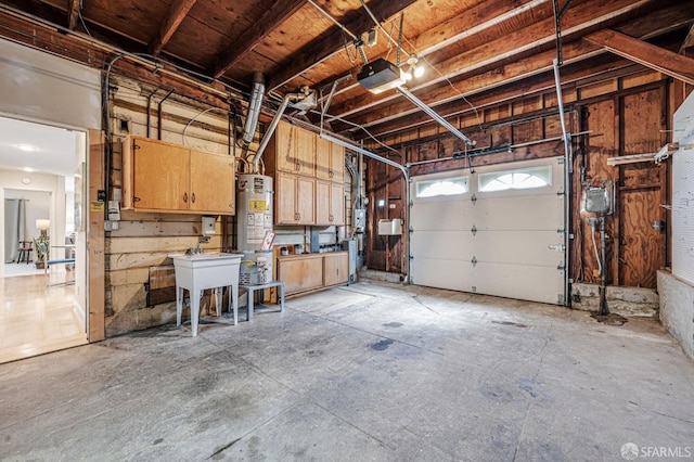 garage with a garage door opener, a sink, and water heater