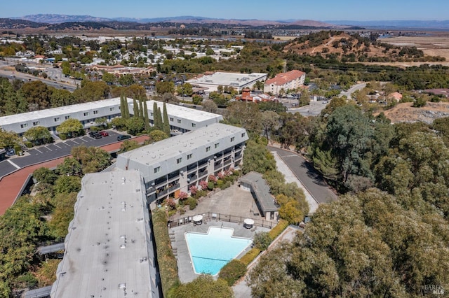 birds eye view of property with a mountain view