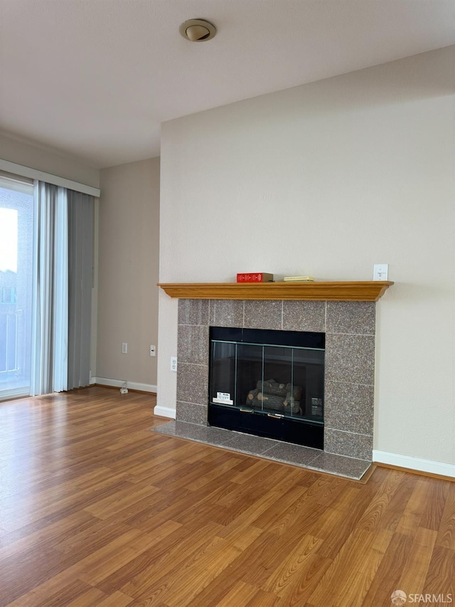 interior details with a fireplace and hardwood / wood-style floors