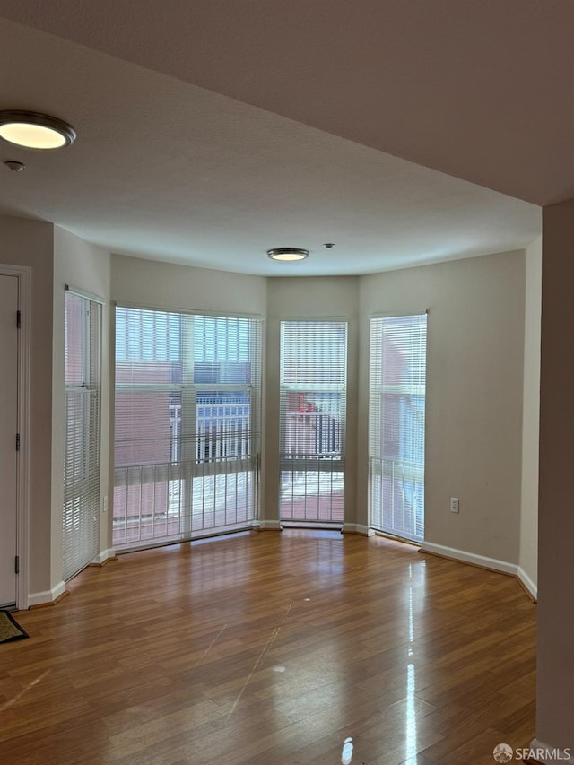 spare room featuring hardwood / wood-style flooring