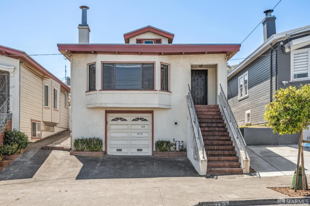 323 Chicago Way, San Francisco, CA 94112 - view of front of house with stucco siding, stairs, and a garage