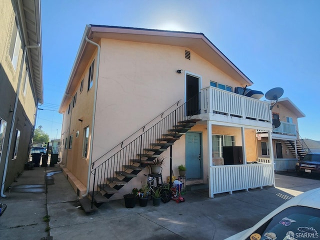 view of property exterior with a balcony