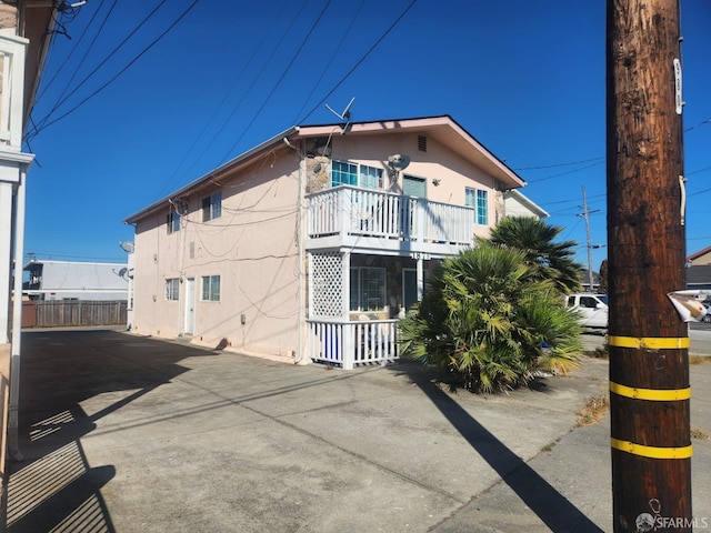 view of property exterior with a balcony