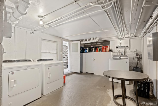 basement with washer and clothes dryer