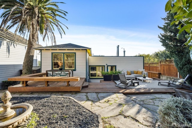 back of house featuring an outdoor hangout area and a deck