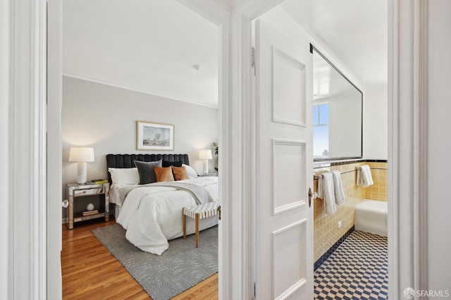 1101 Green St Unit 1402, San Francisco, CA 94109 - bedroom featuring wood finished floors and tile walls