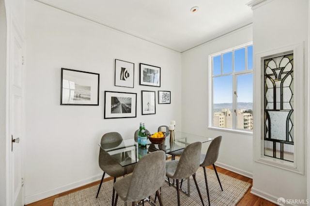 1101 Green St Unit 1402, San Francisco, CA 94109 - dining space with wood finished floors, baseboards, and ornamental molding