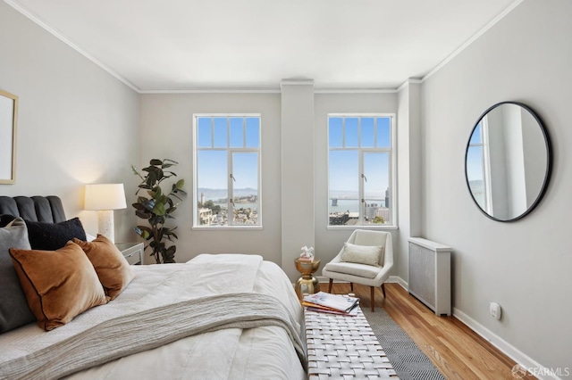 1101 Green St Unit 1402, San Francisco, CA 94109 - bedroom featuring multiple windows, wood finished floors, ornamental molding, radiator, and baseboards
