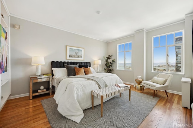 1101 Green St Unit 1402, San Francisco, CA 94109 - bedroom featuring ornamental molding, wood finished floors, and baseboards