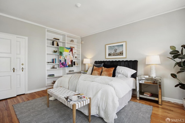1101 Green St Unit 1402, San Francisco, CA 94109 - bedroom featuring ornamental molding, wood finished floors, and baseboards