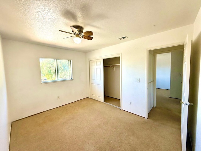 80 Portola Way Unit 105, Tracy, CA 95376 - unfurnished bedroom featuring light colored carpet, a closet, a textured ceiling, and ceiling fan