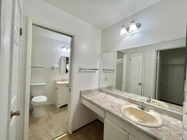 80 Portola Way Unit 105, Tracy, CA 95376 - full bath featuring toilet, vanity, tile patterned flooring, a closet, and baseboards