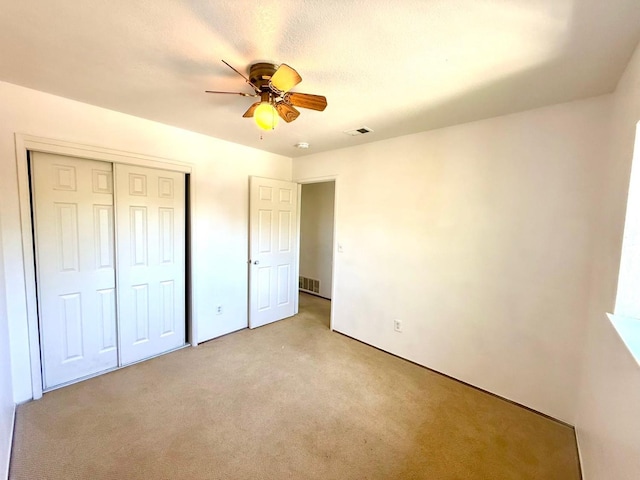 80 Portola Way Unit 105, Tracy, CA 95376 - unfurnished bedroom with light carpet, a closet, and ceiling fan