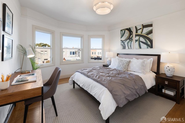 1751 25th Ave, San Francisco, CA 94122 - bedroom featuring wood finished floors and multiple windows