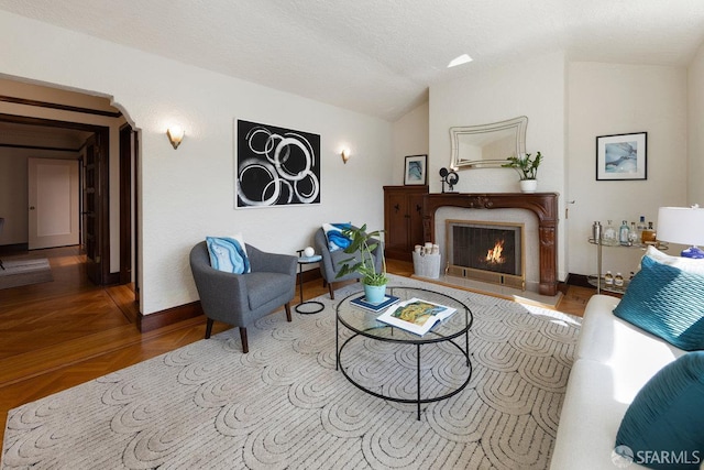 1751 25th Ave, San Francisco, CA 94122 - living area featuring vaulted ceiling and a lit fireplace
