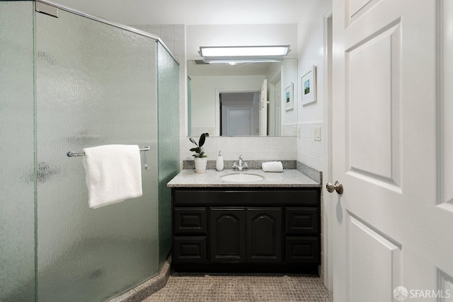 1751 25th Ave, San Francisco, CA 94122 - full bath with vanity, a shower stall, and tile walls