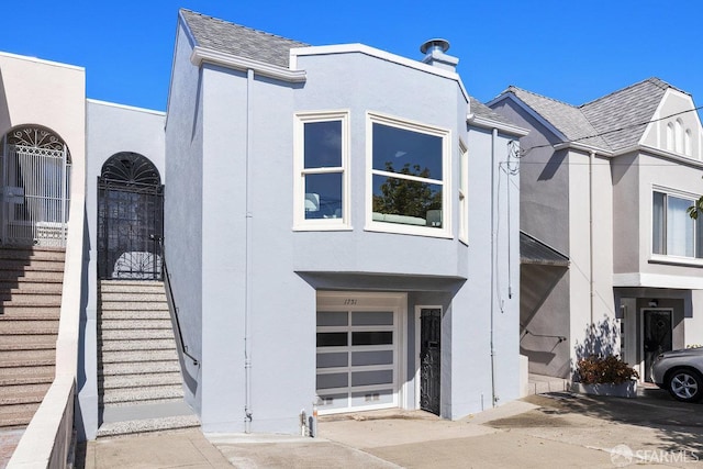 1751 25th Ave, San Francisco, CA 94122 - multi unit property featuring stucco siding and an attached garage