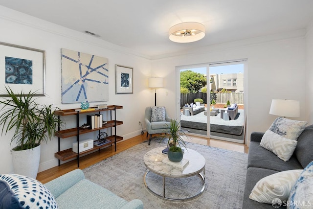 1751 25th Ave, San Francisco, CA 94122 - living area featuring wood finished floors and ornamental molding