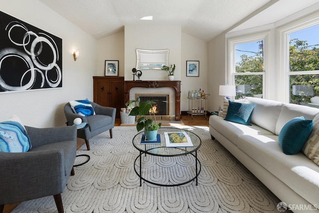 1751 25th Ave, San Francisco, CA 94122 - living room featuring vaulted ceiling, a high end fireplace, and a textured ceiling