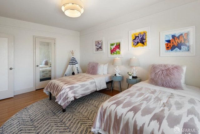1751 25th Ave, San Francisco, CA 94122 - bedroom featuring wood finished floors and baseboards