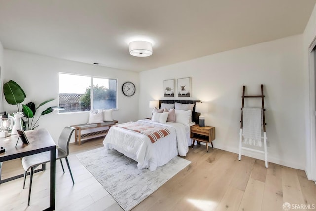 bedroom with light hardwood / wood-style flooring