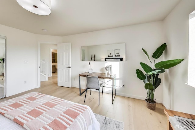 bedroom with light wood-type flooring