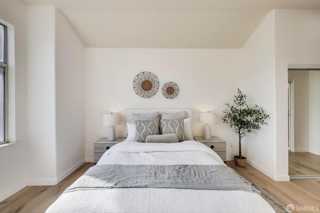 bedroom with hardwood / wood-style floors