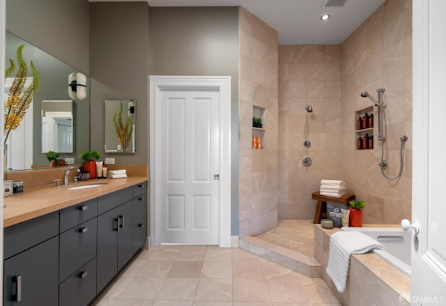 49 Hill St, San Francisco, CA 94110 - bathroom with vanity, walk in shower, tile patterned flooring, tiled tub, and recessed lighting