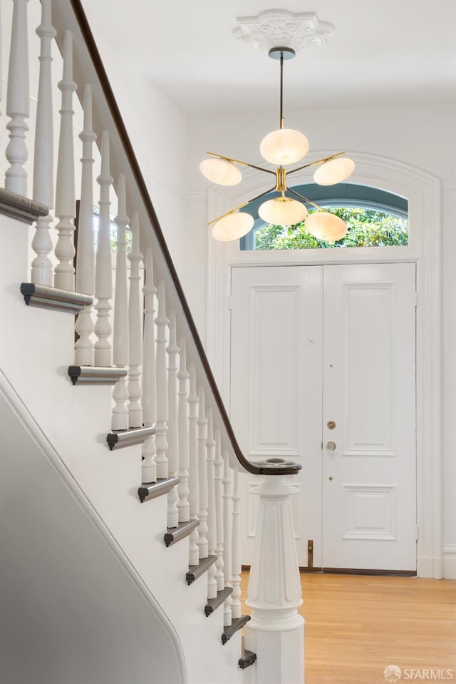 49 Hill St, San Francisco, CA 94110 - foyer with light wood finished floors and stairway
