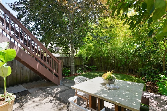 49 Hill St, San Francisco, CA 94110 - fenced backyard featuring a patio and outdoor dining area