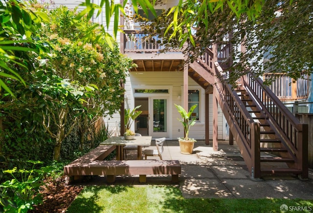 49 Hill St, San Francisco, CA 94110 - rear view of house featuring a patio, stairway, and a wooden deck